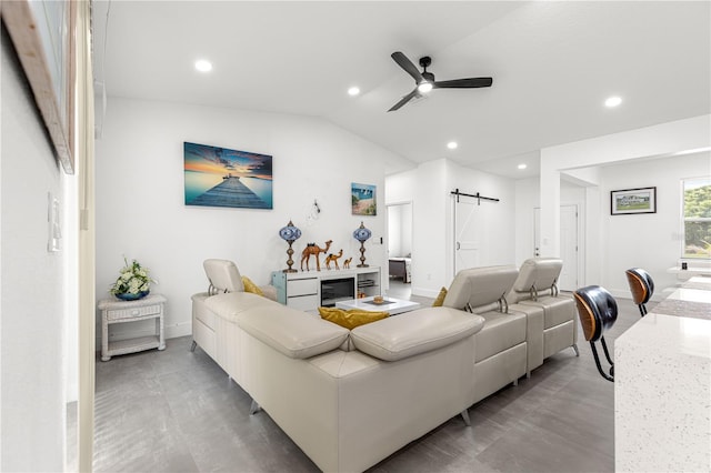 10291 SE 67th Ter, Belleview, FL 34420 - living room featuring a barn door, a ceiling fan, recessed lighting, lofted ceiling, and baseboards