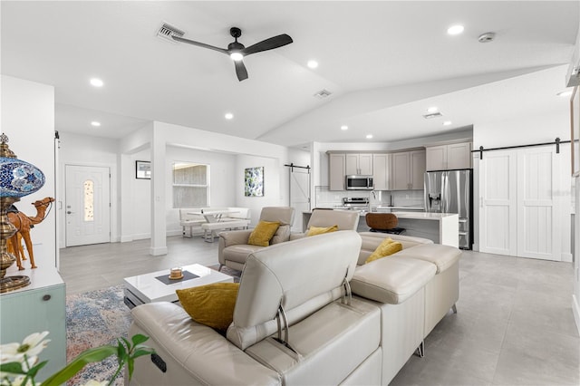 10291 SE 67th Ter, Belleview, FL 34420 - living room featuring a barn door, ceiling fan, vaulted ceiling, and recessed lighting