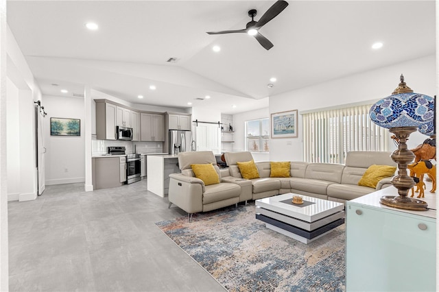 10291 SE 67th Ter, Belleview, FL 34420 - living room with a ceiling fan, vaulted ceiling, a barn door, recessed lighting, and baseboards