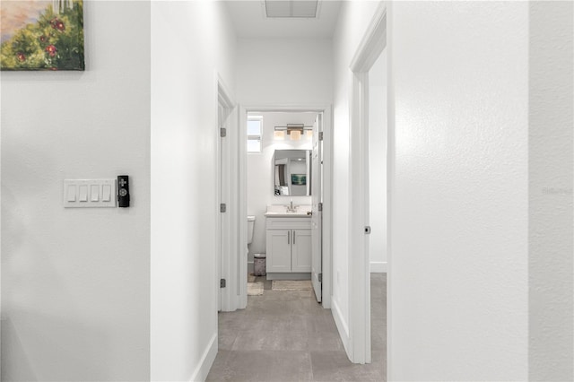 10291 SE 67th Ter, Belleview, FL 34420 - hall with baseboards and a sink