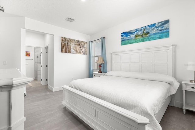 10291 SE 67th Ter, Belleview, FL 34420 - bedroom featuring baseboards and light wood finished floors