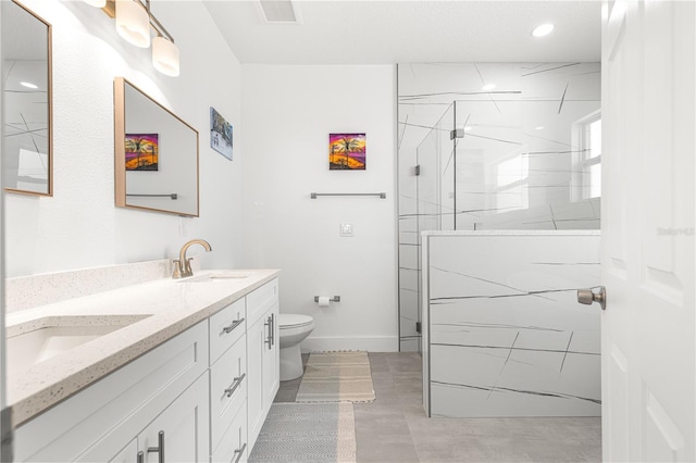 10291 SE 67th Ter, Belleview, FL 34420 - full bath featuring double vanity, walk in shower, toilet, recessed lighting, and baseboards