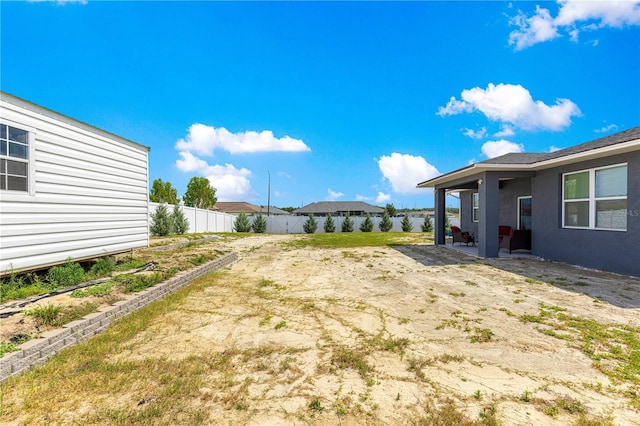 10291 SE 67th Ter, Belleview, FL 34420 - fenced backyard with a patio area