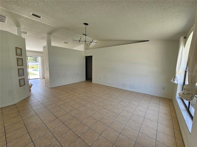 6 Bahia Trace Loop, Ocala, FL 34472 - unfurnished room with a textured ceiling, light tile patterned flooring, vaulted ceiling, a chandelier, and baseboards