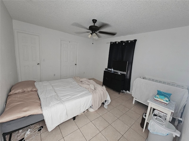 6 Bahia Trace Loop, Ocala, FL 34472 - bedroom featuring light tile patterned flooring, a textured ceiling, and a ceiling fan