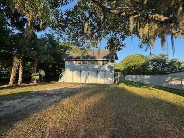 view of outbuilding with fence