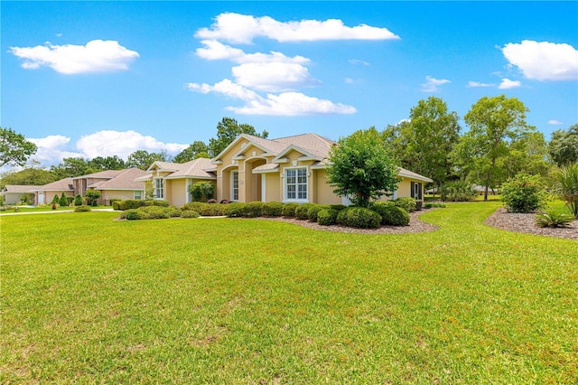 28 Golf View Dr, Ocala, FL 34472 - ranch-style house featuring a front lawn and stucco siding