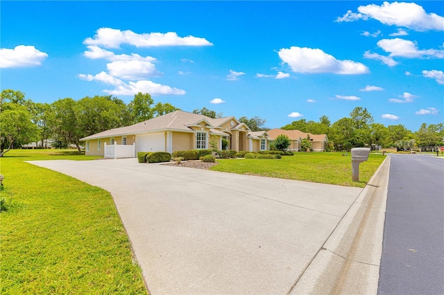 28 Golf View Dr, Ocala, FL 34472 - ranch-style home with an attached garage, driveway, and a front yard