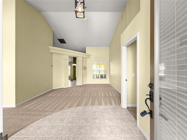 28 Golf View Dr, Ocala, FL 34472 - foyer entrance with light colored carpet, vaulted ceiling, baseboards, and light tile patterned flooring