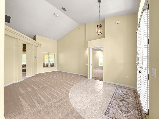 28 Golf View Dr, Ocala, FL 34472 - spare room with high vaulted ceiling, baseboards, healthy amount of natural light, light tile patterned floors, and light colored carpet