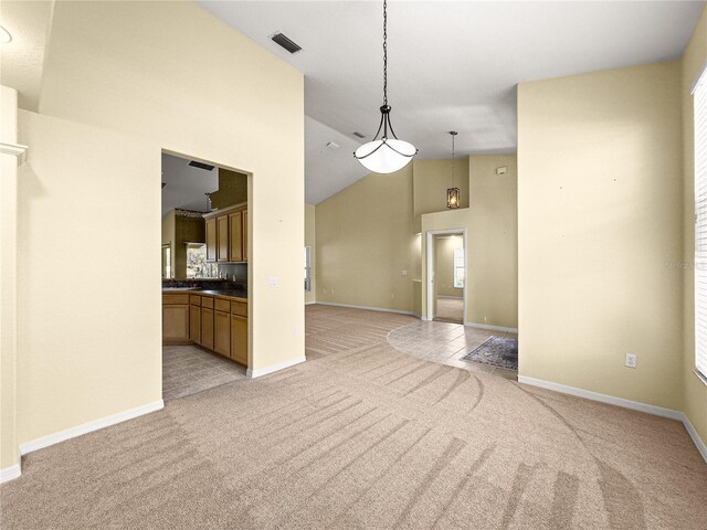 28 Golf View Dr, Ocala, FL 34472 - empty room featuring light colored carpet, baseboards, and high vaulted ceiling