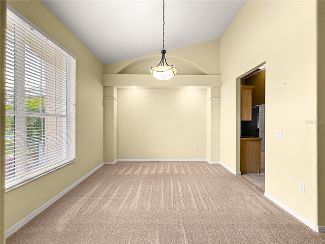 28 Golf View Dr, Ocala, FL 34472 - spare room featuring light carpet, lofted ceiling, and baseboards