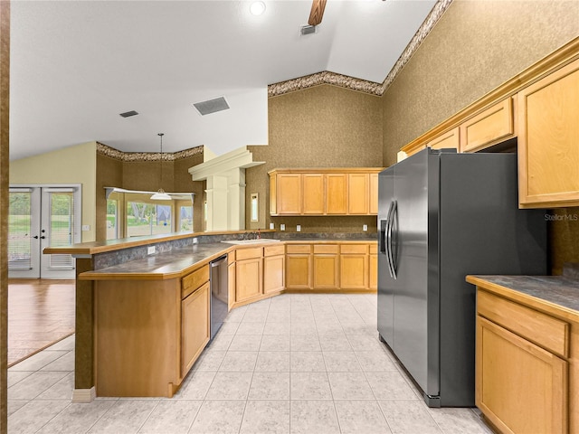 28 Golf View Dr, Ocala, FL 34472 - kitchen with stainless steel dishwasher, a sink, a peninsula, light tile patterned flooring, and black fridge