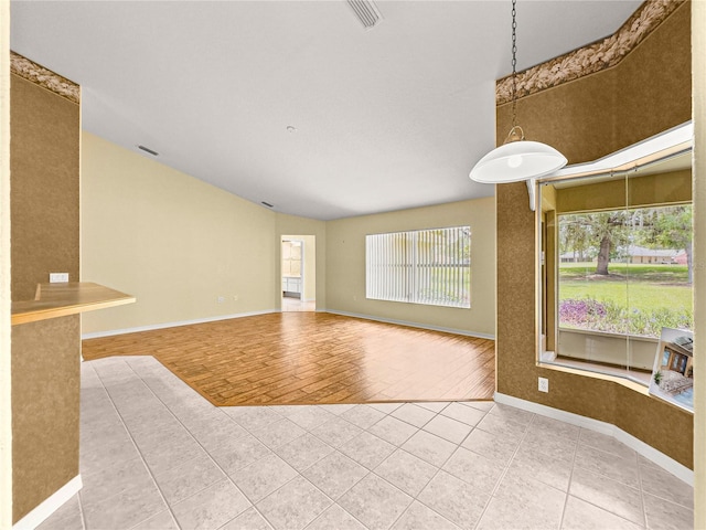28 Golf View Dr, Ocala, FL 34472 - empty room featuring tile patterned flooring, baseboards, and vaulted ceiling