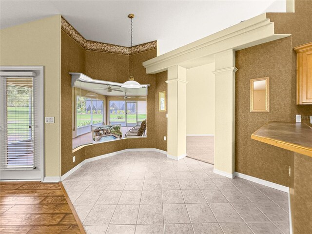 28 Golf View Dr, Ocala, FL 34472 - unfurnished dining area featuring light tile patterned floors, ceiling fan, and a towering ceiling