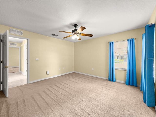 28 Golf View Dr, Ocala, FL 34472 - empty room featuring carpet flooring, a ceiling fan, baseboards, and a textured ceiling
