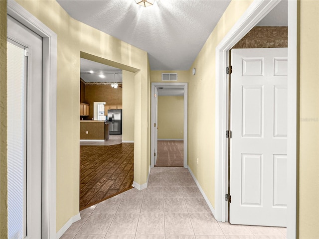 28 Golf View Dr, Ocala, FL 34472 - hall featuring light tile patterned flooring and baseboards