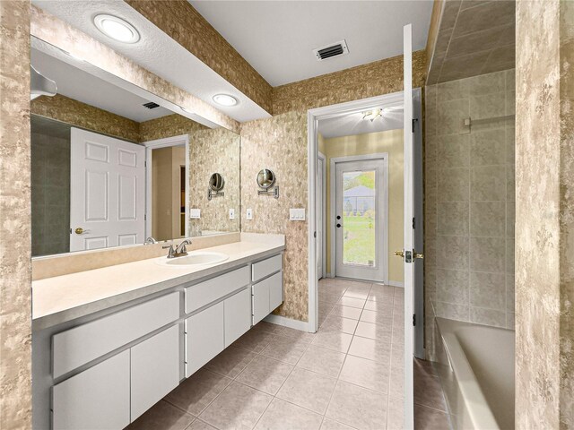 28 Golf View Dr, Ocala, FL 34472 - full bath with tile patterned floors, vanity, baseboards, and a tub