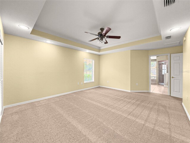 28 Golf View Dr, Ocala, FL 34472 - carpeted spare room with a raised ceiling, ornamental molding, plenty of natural light, baseboards, and a ceiling fan