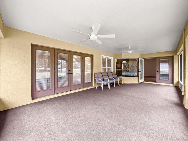28 Golf View Dr, Ocala, FL 34472 - sunroom with french doors, carpet, and a textured wall