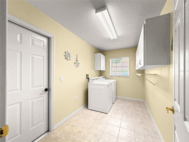 28 Golf View Dr, Ocala, FL 34472 - laundry area with cabinet space, a textured ceiling, washer and clothes dryer, baseboards, and light tile patterned floors
