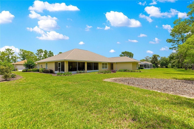 28 Golf View Dr, Ocala, FL 34472 - rear view of house with a lawn and a sunroom