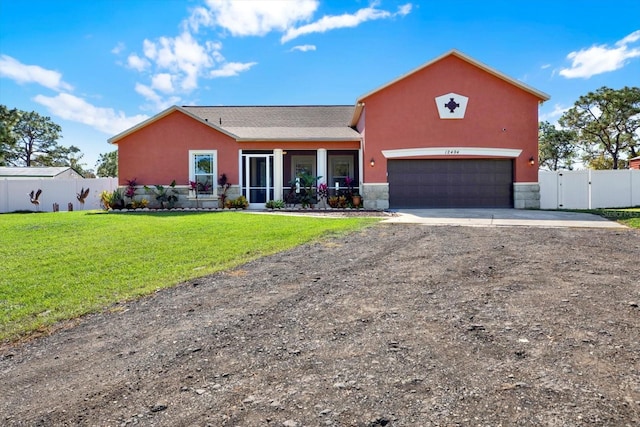 view of front of house featuring concrete driveway, stucco siding, a gate, and stone siding
