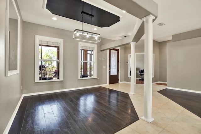 entrance foyer with ornate columns, baseboards, wood finished floors, and recessed lighting