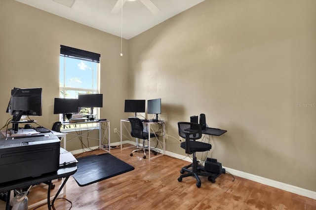 home office with baseboards, wood finished floors, and ceiling fan