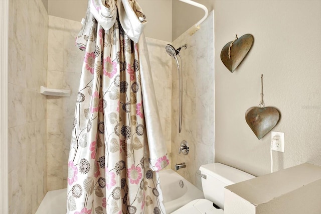 bathroom with shower / bath combination with curtain and toilet