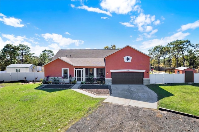 view of front of house featuring concrete driveway, a gate, stucco siding, and a sunroom