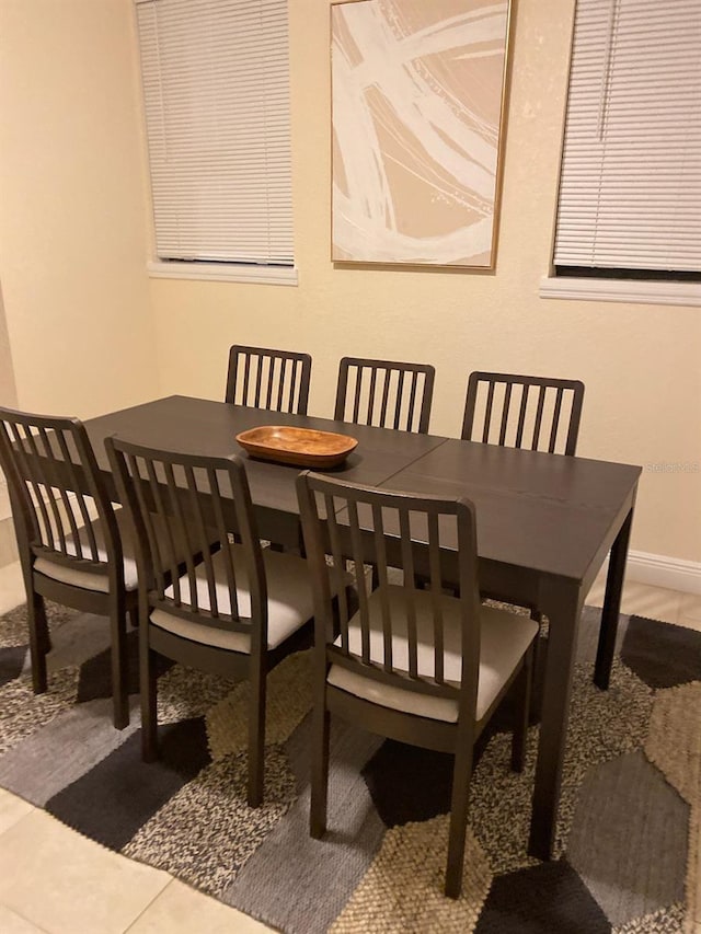 dining room featuring baseboards