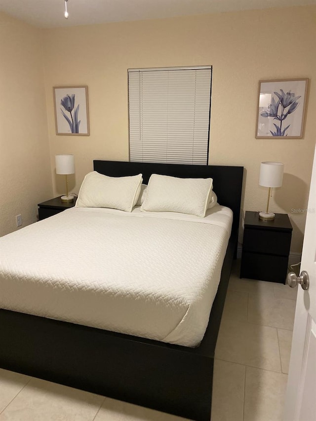 bedroom featuring light tile patterned floors