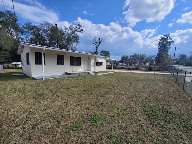 rear view of house with a carport