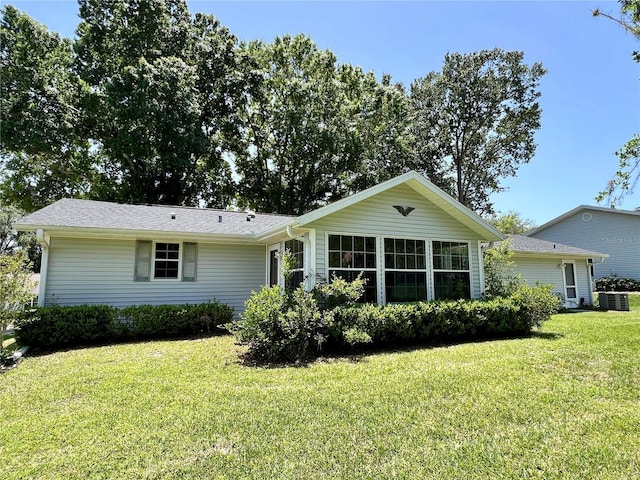 8239 SW 108th St, Ocala, FL 34481 - ranch-style house with central air condition unit and a front yard