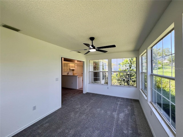 8239 SW 108th St, Ocala, FL 34481 - unfurnished sunroom featuring a textured ceiling, baseboards, and carpet flooring