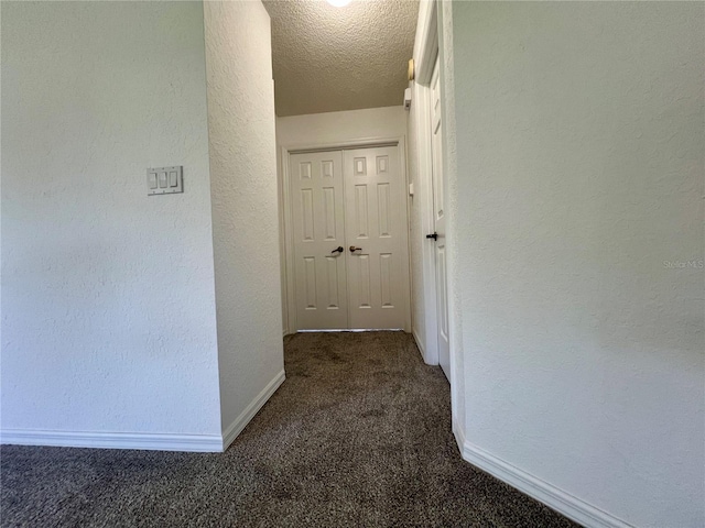 8239 SW 108th St, Ocala, FL 34481 - corridor featuring carpet flooring, baseboards, a textured wall, and a textured ceiling