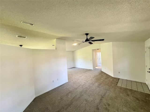 8239 SW 108th St, Ocala, FL 34481 - spare room with carpet floors, a ceiling fan, a textured ceiling, vaulted ceiling, and baseboards