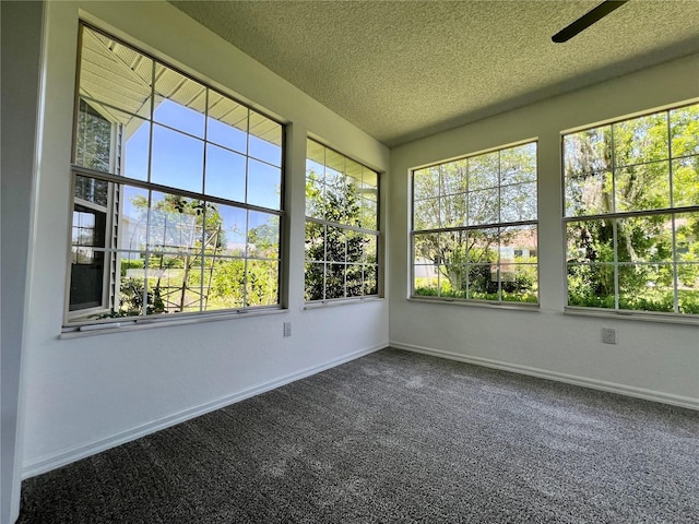 8239 SW 108th St, Ocala, FL 34481 - spare room featuring healthy amount of natural light, dark carpet, a textured ceiling, baseboards, and ceiling fan