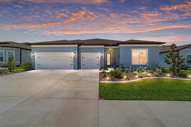 6046 SW 86th Cir, Ocala, FL 34481 - prairie-style house with a garage, stucco siding, driveway, and a front yard