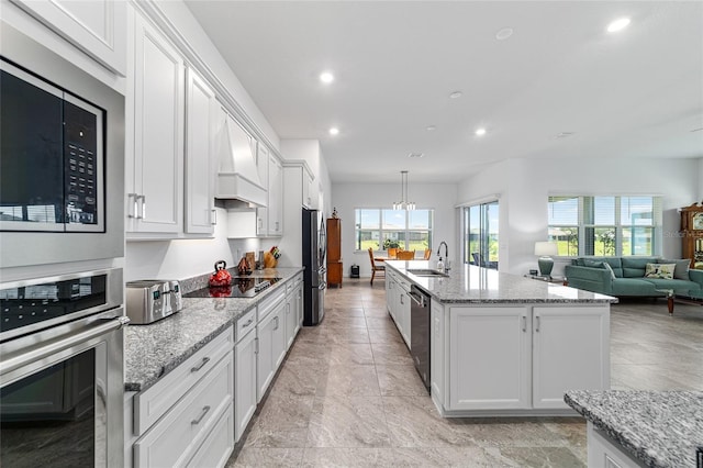 6046 SW 86th Cir, Ocala, FL 34481 - kitchen featuring stainless steel appliances, a sink, premium range hood, recessed lighting, and white cabinets