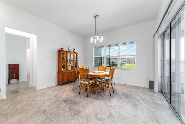 6046 SW 86th Cir, Ocala, FL 34481 - dining area with baseboards and a chandelier
