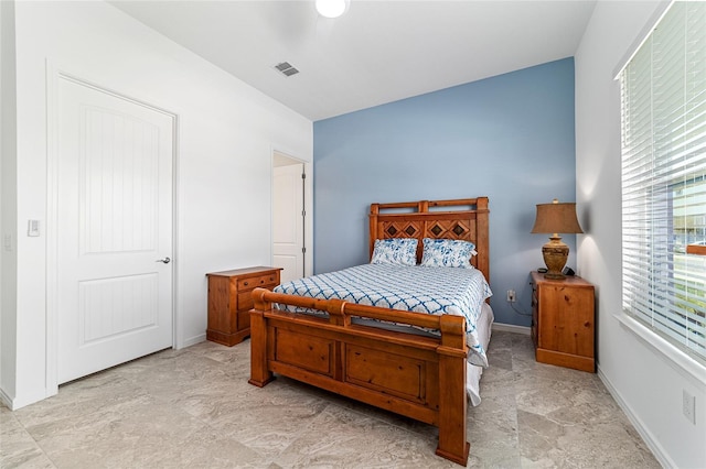 6046 SW 86th Cir, Ocala, FL 34481 - bedroom featuring baseboards and light stone finish flooring