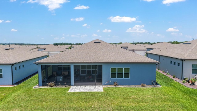 6046 SW 86th Cir, Ocala, FL 34481 - back of house featuring a shingled roof, a sunroom, a lawn, and stucco siding