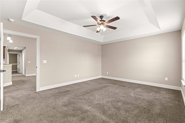 10313 SW 45th Ave, Ocala, FL 34476 - carpeted empty room with a raised ceiling, ceiling fan, a smoke detector, and baseboards