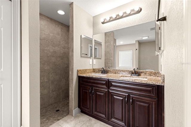 10313 SW 45th Ave, Ocala, FL 34476 - bathroom with double vanity, a walk in shower, and tile patterned flooring