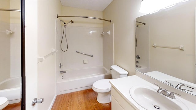 full bathroom with toilet, wood finished floors, and bathing tub / shower combination