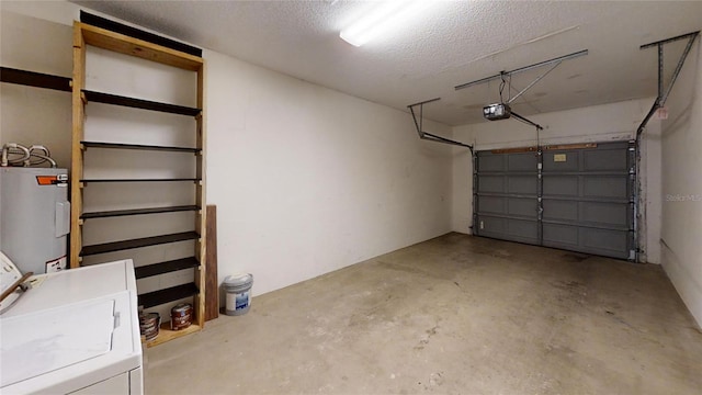 garage featuring water heater, washing machine and dryer, and a garage door opener