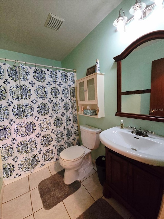 bathroom featuring toilet, tile patterned flooring, vanity, and a shower with curtain