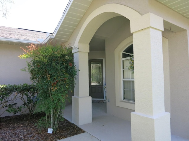1799 W Shanelle Path, Lecanto, FL 34461 - doorway to property featuring stucco siding
